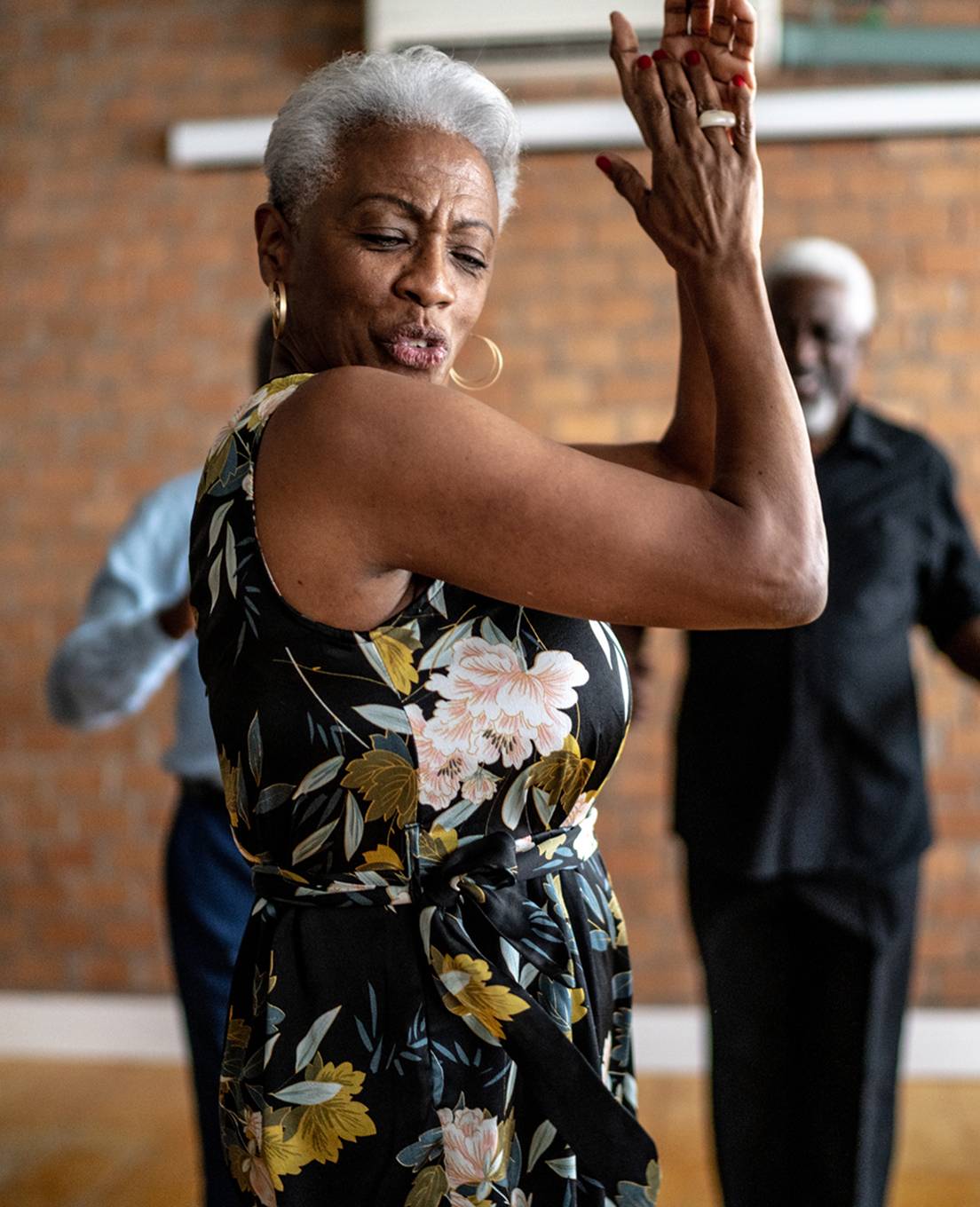 Resident participating in a dance activity during a community event