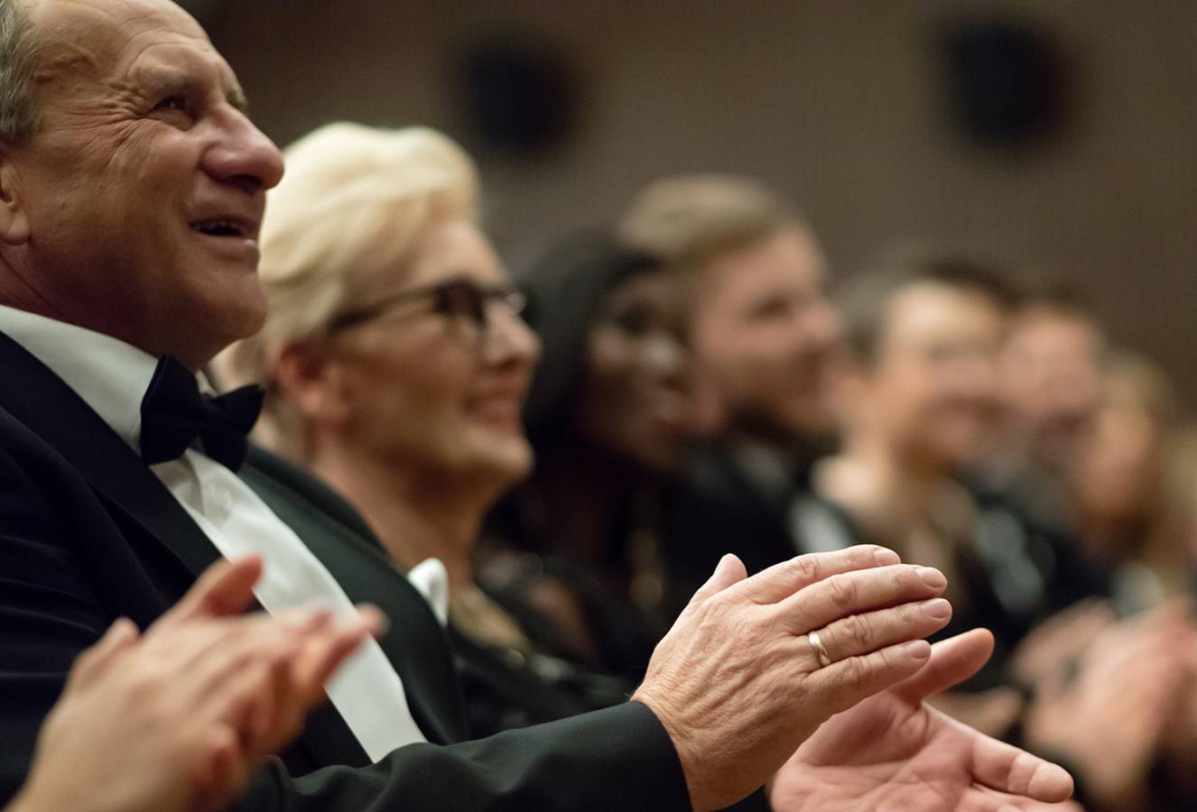 Resident playing tennis as part of an active lifestyle program