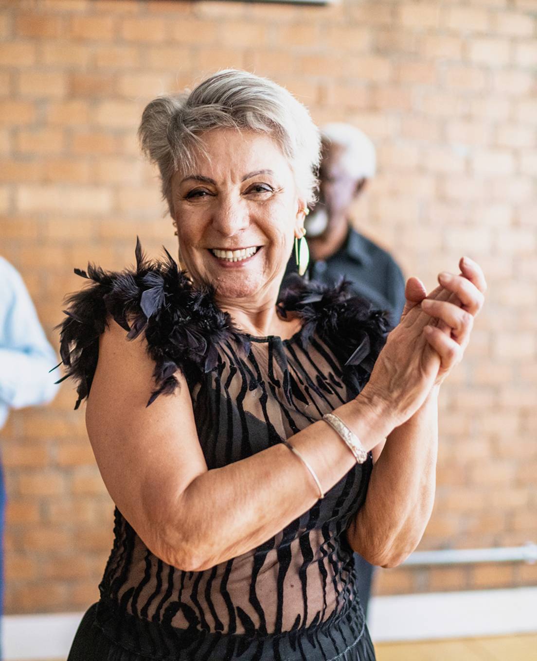 Senior woman dancing and enjoying a community social event