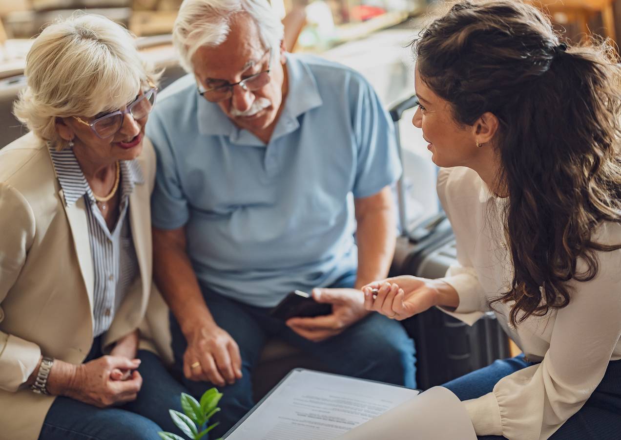 Residents meeting with a staff member to discuss services in a relaxed environment